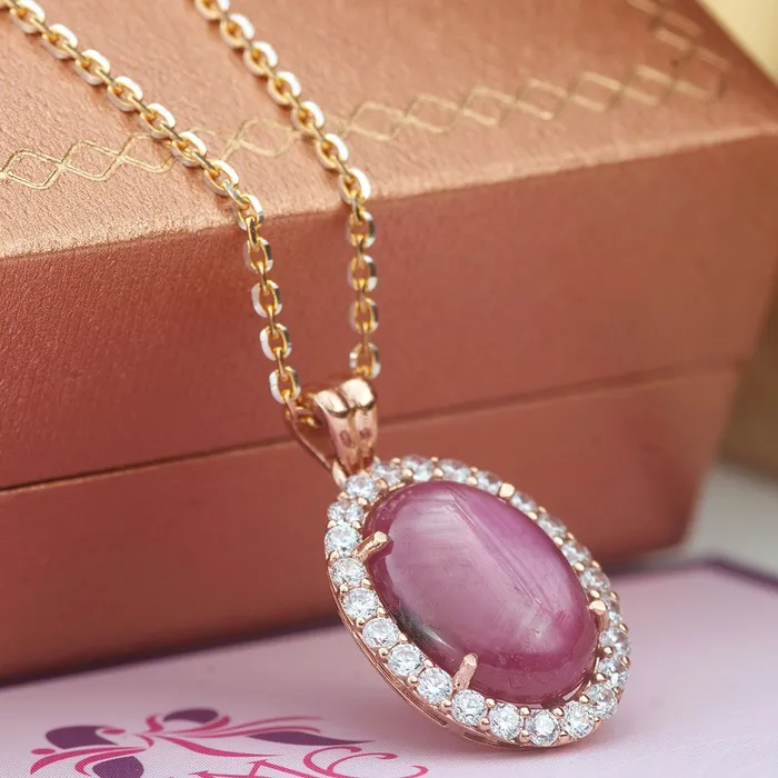 AME Jewellery Necklaces Natural OvalCabochon Ruby Halo Pendant in 14karat rose gold AME Jewellery Necklaces Natural OvalCabochon Ruby Halo Pendant in 14karat rose gold