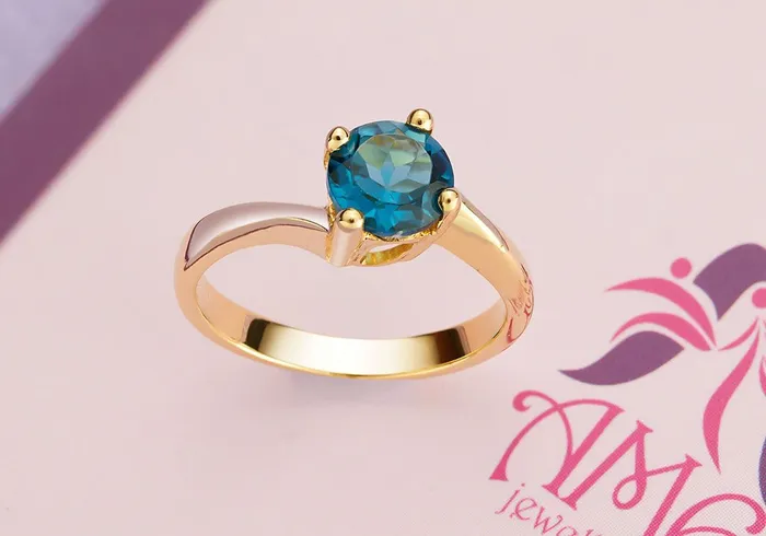 AME Jewellery Rings 6mm Blue Topaz twist Ring in 14K Yellow Gold