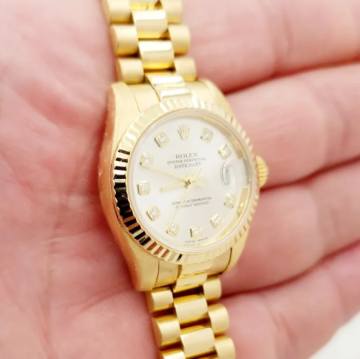 Ladies Rolex 26mm Presidential 18K Yellow Gold Watch with Silver Diamond Dial and Fluted Bezel PreOwned Rolex PreStyled Sets