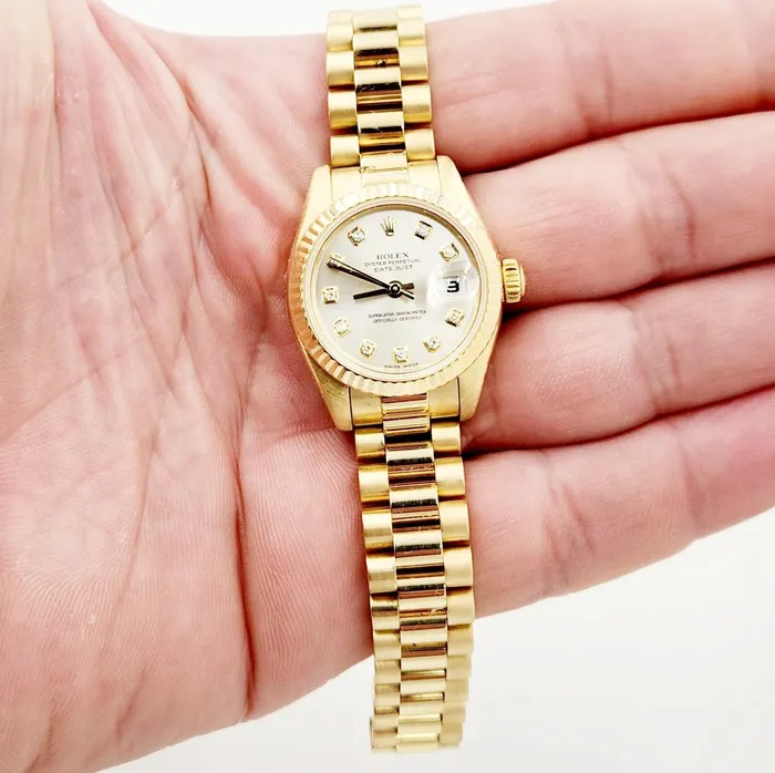 Ladies Rolex 26mm Presidential 18K Yellow Gold Watch with Silver Diamond Dial and Fluted Bezel PreOwned Rolex PreStyled Sets