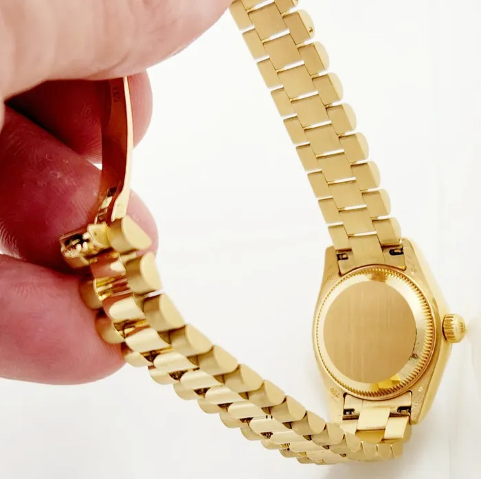 Ladies Rolex 26mm Presidential 18K Yellow Gold Watch with Silver Diamond Dial and Fluted Bezel PreOwned Rolex PreStyled Sets