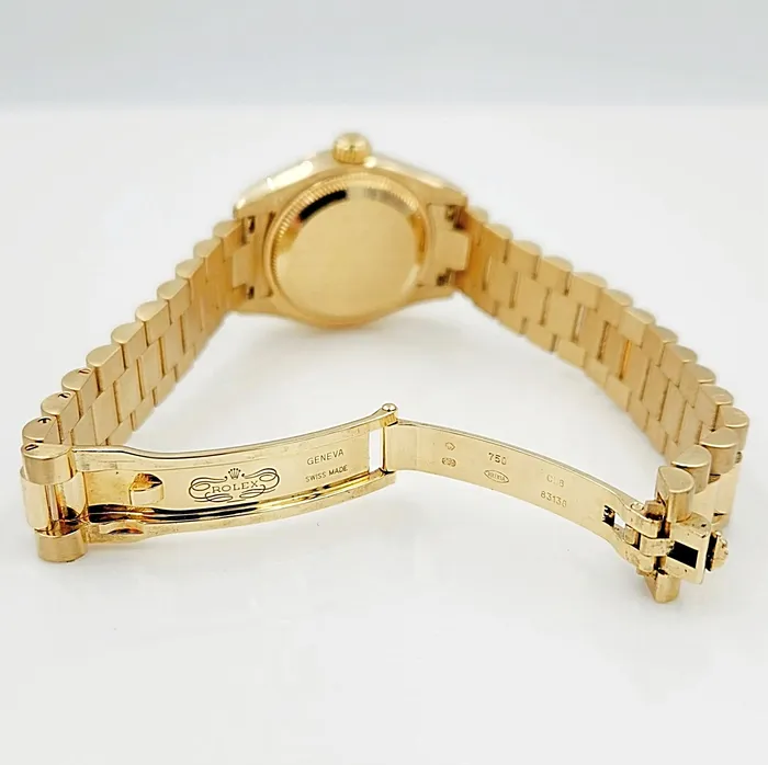 Ladies Rolex 26mm Presidential 18K Yellow Gold Watch with Silver Diamond Dial and Fluted Bezel PreOwned Rolex PreStyled Sets