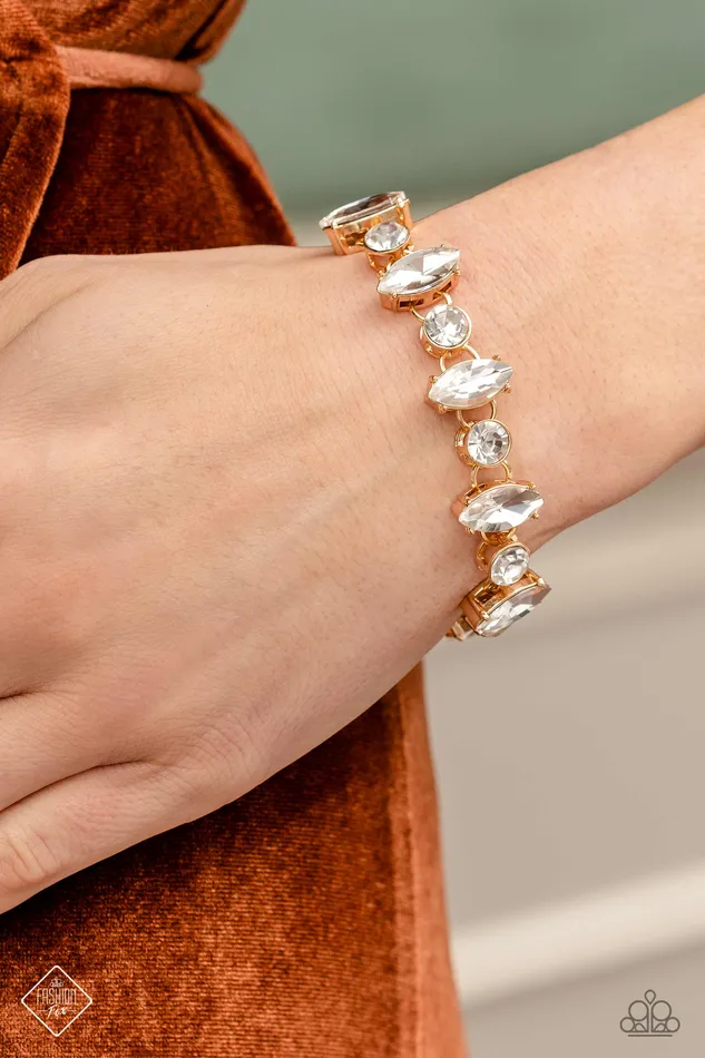 Paparazzi Accessories Bracelets Exclusively Extravagant Gold with White Rhinestone Bracelet Paparazzi Fashion Fix March 2023