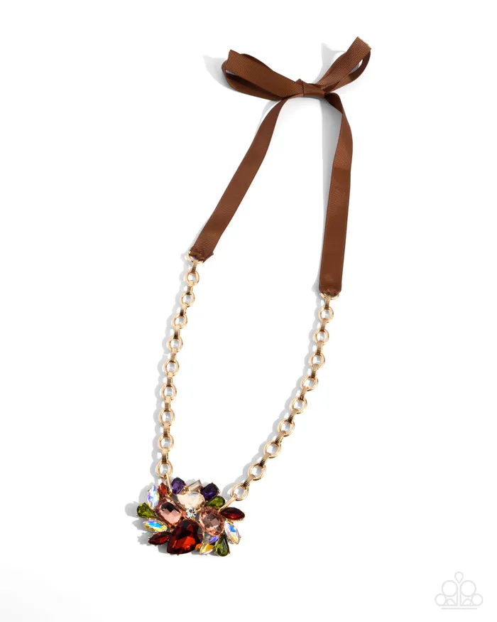 Tantalizing Tapestry Brown Ribbon UV Iridescent Gem Gold Long Necklace Paparazzi Paparazzi Accessories Necklaces Tantalizing Tapestry Brown Ribbon UV Iridescent Gem Gold Long Necklace Paparazzi Paparazzi Accessories Necklaces